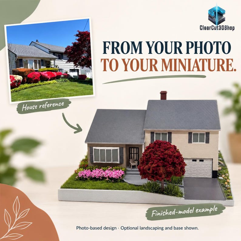 Photo-based comparison of a cream house reference photograph and its corresponding miniature, with grey roofs, a red tree and pink flowers. From Your Photo to Your Miniature. Landscaping and display base are optional.