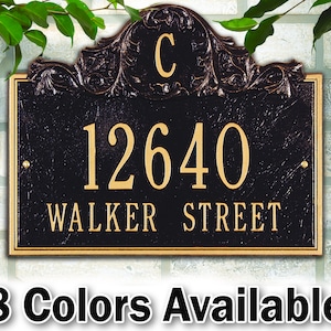 May include: Black and gold house number plaque with a decorative scroll design. The plaque reads "12640 WALKER STREET" and features a letter "C" in the scroll design.