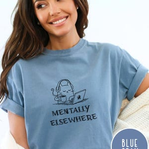 Comfort Colors brain fog t-shirt with minimalist cat illustration and text Mentally Elsewhere