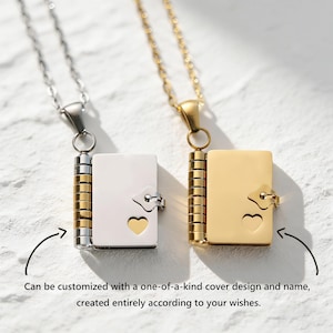 May include: Two pendant necklaces, one silver and one gold, each with a small, book-shaped locket. The lockets have a heart-shaped cutout and a clasp. The text reads, "Can be customized with a one-of-a-kind cover design and name, created entirely according to your wishes."