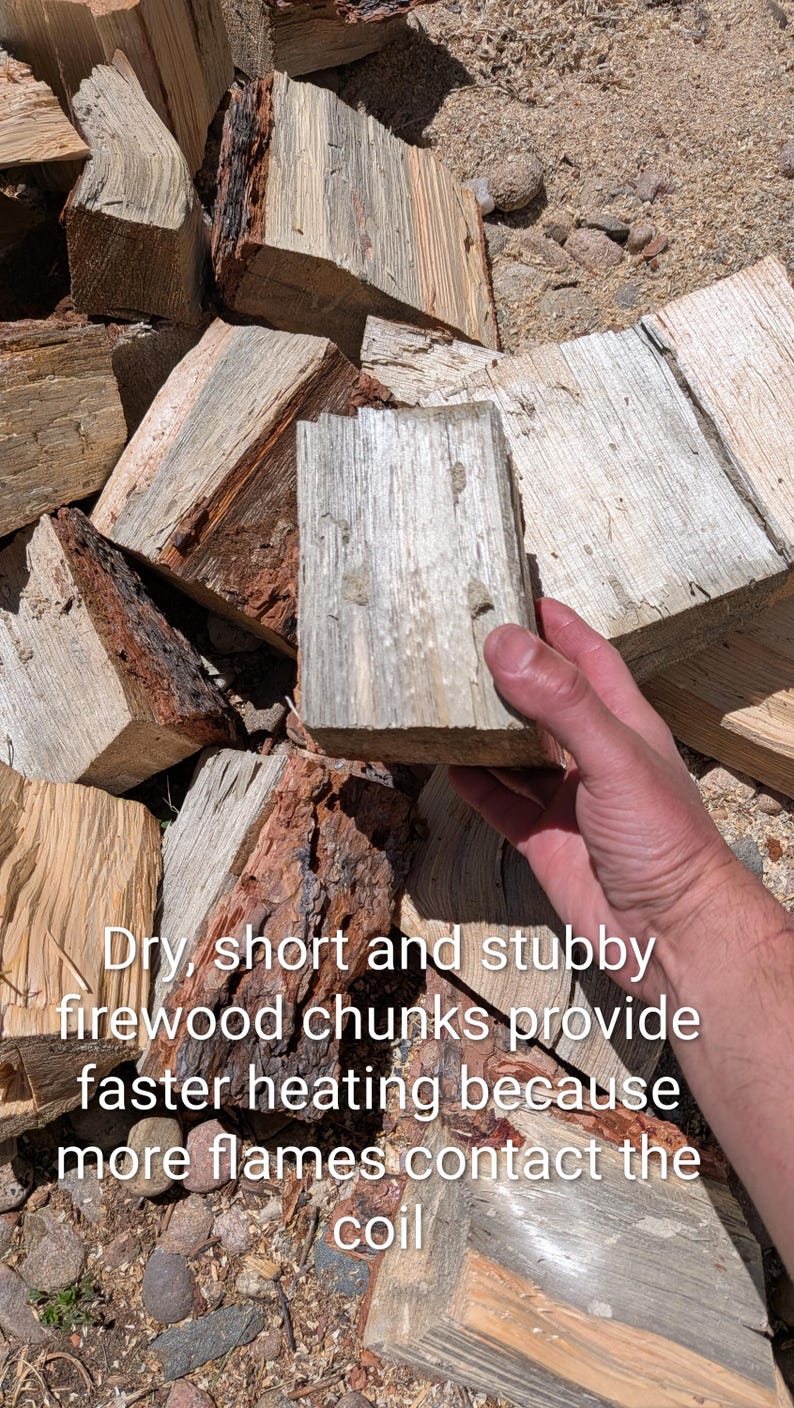 May include: Pile of dry, stubby firewood chunks. The wood is a mix of light and dark brown, with visible grain and texture. The text on the image says: "Dry, short and stubby firewood chunks provide faster heating because more flames contact the coil."