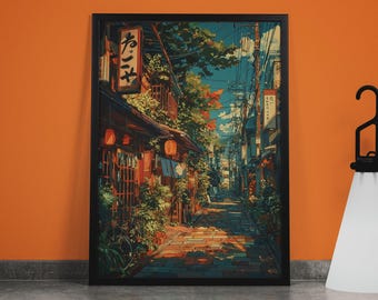 May include: Framed art print depicting a Japanese street scene. The artwork features a narrow cobblestone street lined with traditional buildings, lanterns, and lush greenery. The sky is a mix of blue and white, with power lines overhead.