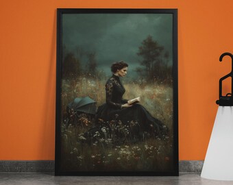 May include: Framed art print featuring a woman in a black dress reading in a field of wildflowers. The artwork has a dark, moody aesthetic with a teal umbrella and a dark sky in the background. The frame is black.