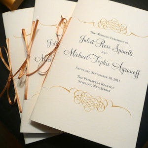 May include: Wedding ceremony program with gold ribbon and calligraphy. The wedding ceremony of Juliet Rose Spinelli and Michael Topkis Agranoff. Saturday, September 10, 2011. The Primavera Regency, Stirling, New Jersey.
