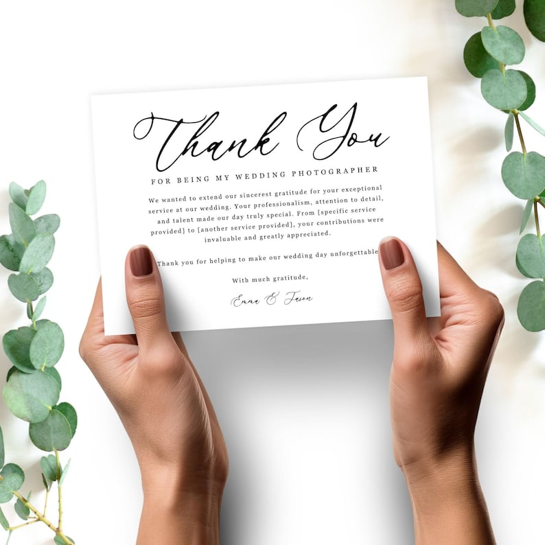 May include: A thank you card for a wedding photographer with the text "Thank You for being my wedding photographer". The card has a handwritten font and includes the names "Enne & Frva" at the bottom.