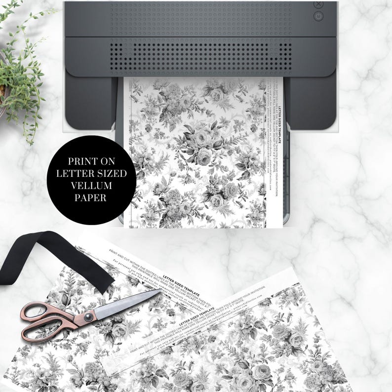May include: A black and white floral pattern printed on a sheet of vellum paper. The paper is being fed into a printer. The text "PRINT ON LETTER SIZED VELLUM PAPER" is visible in the image.