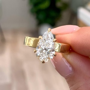 Pear Cut Solitaire Moissanite Diamond With Wide Gold Cigar Band Six Claw Prong Setting Wide Band Ring 18kt Solid gold Ring For Women