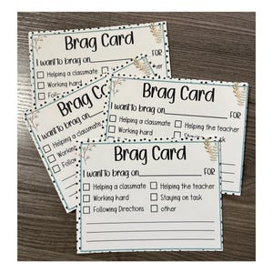 May include: A stack of rectangular white Brag Card stationery featuring a black polka dot border and small floral accents. Each card includes the text Brag Card, I want to brag on, and a checklist with options like Helping a classmate and Working hard.