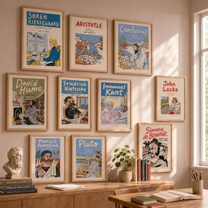 May include: A gallery wall featuring ten framed art prints of philosophers including Søren Kierkegaard, Aristotle, Confucius, David Hume, Friedrich Nietzsche, Immanuel Kant, John Locke, Marcus Aurelius, Plato, and Simone de Beauvoir in a light room.