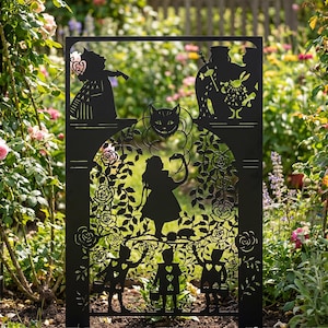May include: Black metal garden screen depicting scenes from Alice in Wonderland. The design includes the Queen of Hearts, the Cheshire Cat, Alice, and playing card figures, set against a backdrop of roses and foliage.