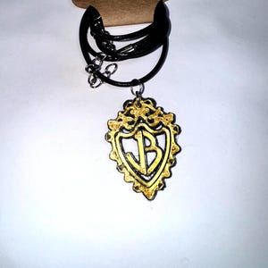 Jonas Brothers crest necklace