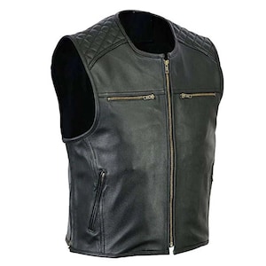 May include: Black leather vest with a quilted shoulder design and a full-length zipper. The vest has two zippered chest pockets and a vertical zippered pocket on the left side. The vest is sleeveless and has a round collar.