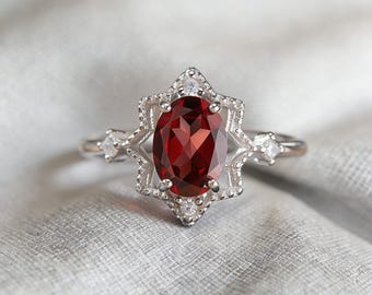 Anillo ajustable de plata 925 con halo de estrella y granate