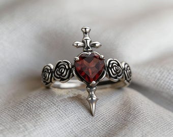 Anillo de plata 925 con granate rosa y piedra natal de enero, estilo gótico abierto.