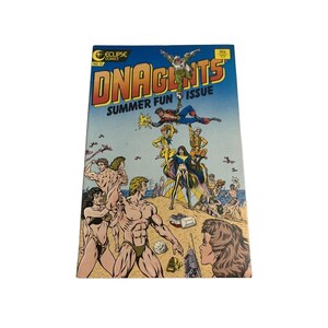 May include: A vintage comic book titled "DNAgents Summer Fun Issue" with a blue cover. The cover art features several muscular figures on a beach, with the title in orange and yellow. The comic is from Eclipse Comics.