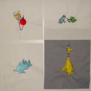 May include: Embroidered fabric squares featuring characters from a children's book. The top left square shows a blonde girl holding a red object. The top right square has two creatures. The bottom left square has a blue elephant-like creature. The bottom right square has a yellow bird-like creature.