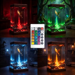 May include: A rectangular resin lamp featuring a miniature dragon figurine inside, emitting light in red, green, blue, or orange. The lamp has a dark wooden base and top, and includes a white remote control with multiple color buttons for light adjustment.