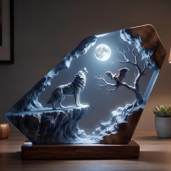 A howling wolf mid-scene inside glowing epoxy resin — it shifts colors and doubles as a full-moon diorama night light that looks like it belongs in a fantasy novel.