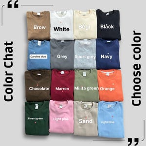 May include: An assortment of folded sweatshirts in a variety of colours, including grey, navy, and pink. The image features the text "Color Chat" and "Choose color". Each sweatshirt is labelled with its colour name, such as "Chocolate" and "Light blue".