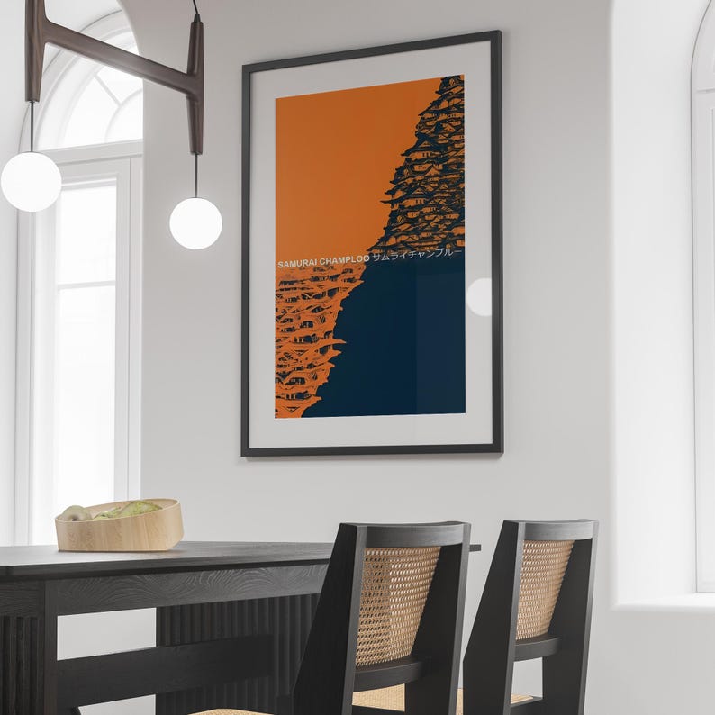 May include: A framed print with a black frame and a white mat. The print features a graphic design of a cityscape in orange and blue with the text "SAMURAI CHAMPLOO サムライチャンプルー" in black.