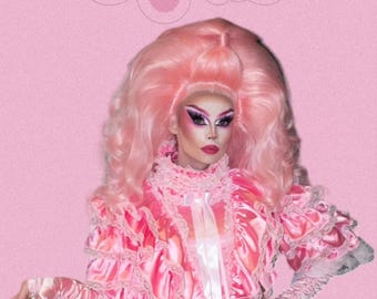 May include: A person wearing a pink dress with lace trim and a pink wig. The background is pink with the text "R-12" in a pink, cursive font.