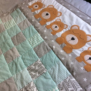Handmade patchwork and appliqué baby quilt