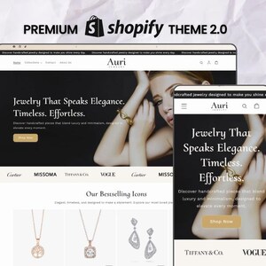 Könnte beinhalten: Ein Website-Design für ein Schmuckgeschäft, das auf einem Laptop und einem Smartphone angezeigt wird. Die Website hat ein Schwarz-Weiß-Farbschema mit dem Text "Jewelry That Speaks Elegance. Timeless. Effortless." und dem Markennamen "Auri".