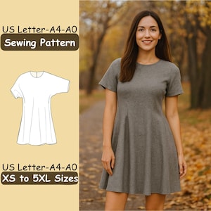 Könnte beinhalten: Eine Frau trägt ein graues Kleid mit kurzen Ärmeln. Das Bild enthält eine Nähmaschinenmusterillustration und den Text "US Letter-A4-A0 Sewing Pattern" und "XS to 5XL Sizes". Der Hintergrund zeigt einen Weg durch einen Park mit Herbstlaub.