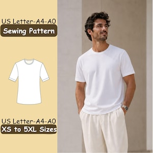 May include: A sewing pattern for a t-shirt with text reading US Letter-A4-A0 Sewing Pattern and US Letter-A4-A0 XS to 5XL Sizes. The image displays a white t-shirt with short sleeves and a round neckline, shown as a line drawing and worn by a model.