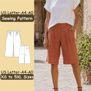 May include: A sewing pattern for knee-length shorts with a white line drawing illustration on a light yellow background. The text reads US Letter-A4-A0 Sewing Pattern and US Letter-A4-A0 XS to 5XL Sizes. The shorts feature a high waist and pleats.