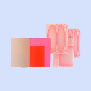 May include: An open book with beige pages next to a stack of pink and orange geometric shapes. The stack includes a design of pink ovals and circles, and a checkered pattern, all against a light blue background.