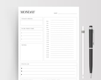May include: A printable and digital daily planner with a black and white design. The planner has sections for "Today's Mood", "In My Free Time", "Notes", "Focus On", "Must Be Done", and "I Am Grateful For". The planner also includes a section for time management with hourly slots from 6:00 AM to 11:00 PM.