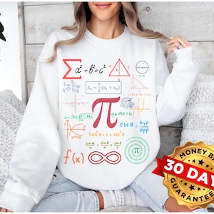 May include: White sweatshirt with a graphic print of various mathematical formulas and symbols, including the Pythagorean theorem, the sum of an arithmetic series, the equation for a line, and the value of pi. The graphic is in black, red, and blue.