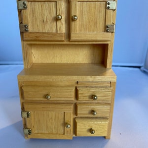 Miniature wooden cabinet with pull out board