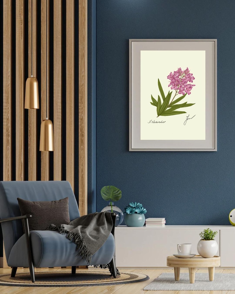 Oleander print in a white frame with passpartout hanging on a blue wall