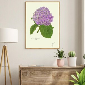 Hortensia print in a wooden frame hanging on a white wall