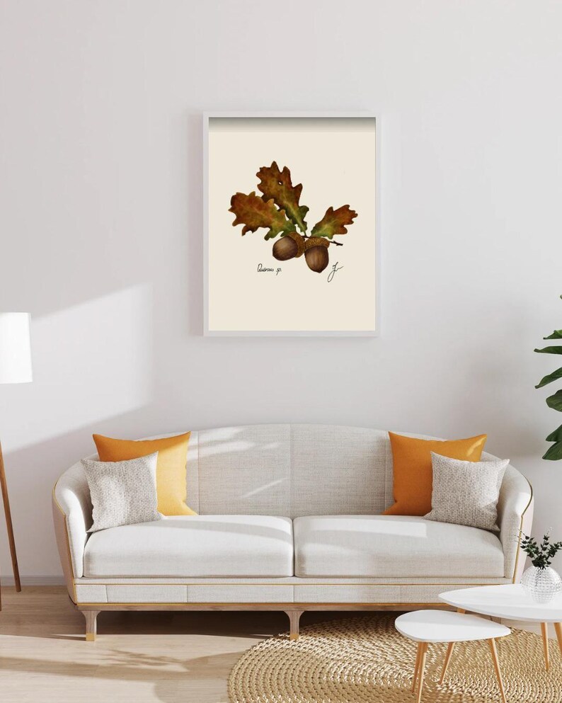 Quercus print in a white framed print on a white wall above a white couch
