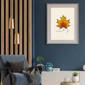Acer print in a white frame with passpartout hanging on a blue wall
