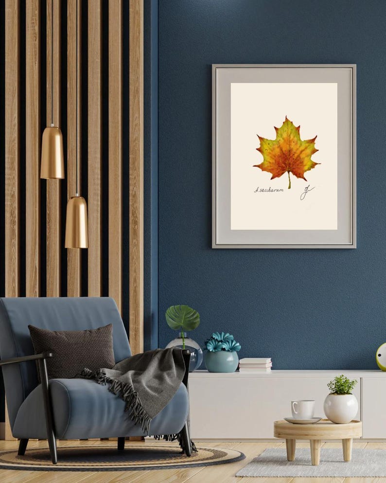Acer print in a white frame with passpartout hanging on a blue wall