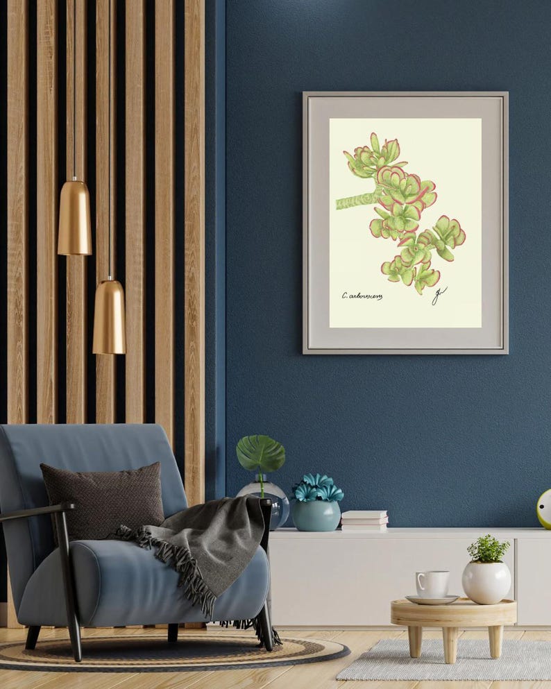 Jade print in a white frame with passpartout hanging on a blue wall