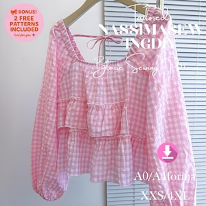 May include: A pink and white gingham blouse with long sleeves and a square neckline. The blouse has a tiered ruffle design and a bow detail at the back. Text on the image includes "Tailored NASSIMASEW INGD Blouse Sewing" and "A0/A forma XXS/4XL".
