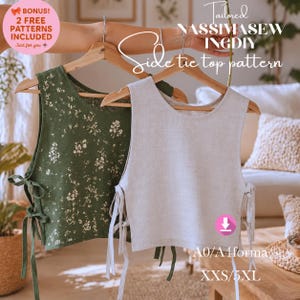 Puede incluir: Dos tops sin mangas con lazos laterales colgados en perchas de madera. Un top es verde oliva con un estampado floral blanco y el otro es beige claro liso. Ambos tienen lazos laterales y el texto Tailored NASSI MASEWINGDIY Side tie top pattern.