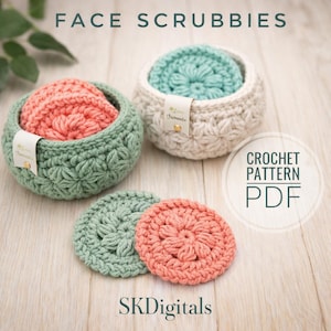 May include: Crocheted face scrubbies in a variety of colors, including coral, mint green, and cream, are displayed in matching crocheted baskets. The image also includes the text "FACE SCRUBBIES" and "CROCHET PATTERN PDF".
