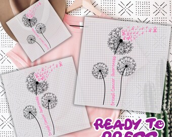 May include: Pink t-shirt and sublimation transfers featuring a dandelion design with pink ribbons and the text "Breast Cancer Awareness." The transfers are on a grid background, with the words "READY TO PRESS" in purple.