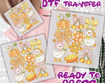 May include: DTF transfer sheets with fall-themed illustrations. Designs include pumpkins, bows, ducks, and pie. The text "DTF TRANSFER" and "READY TO PRESS" are visible.
