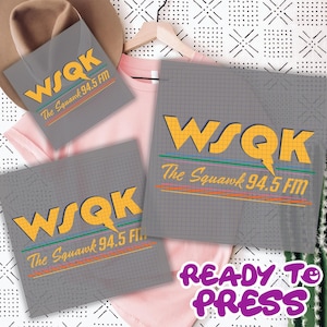 May include: Gray ready-to-press transfer sheets and a pink t-shirt. The sheets feature the text "WSQK The Squawk 94.5 FM" in yellow and green. The phrase "READY TO PRESS" is in purple.