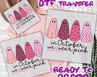 May include: DTF transfer sheets featuring pink ghost designs with various patterns, including leopard print, hearts, and checkered patterns. The text "in October we wear pink" is included, along with a pink ribbon. The words "READY TO PRESS" are also visible.