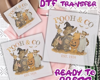 May include: DTF transfer sheets featuring a cartoon illustration of Winnie the Pooh and friends in Halloween costumes. The text "POOH & CO" and "EST. 1926" are visible. The words "READY TO PRESS" are also displayed.