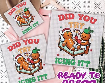 May include: A design featuring a gingerbread man with a broken leg being treated by another gingerbread man. The text "DID YOU TRY ICING IT?" is displayed in red and green. The phrase "READY TO PRESS" is also visible.