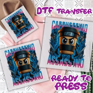 May include: DTF transfer featuring a cartoon cappuccino cup character with ninja-inspired design. The design includes the text "Cappuccinno" and "Assassino" in a blue and pink gradient, with a "Ready to Press" label.